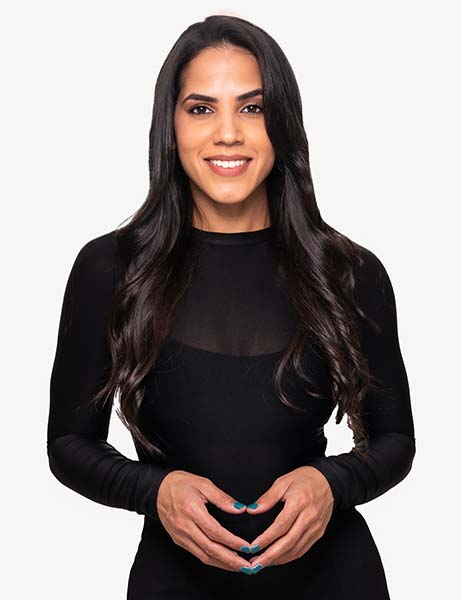 Woman posing in black longsleeve dress